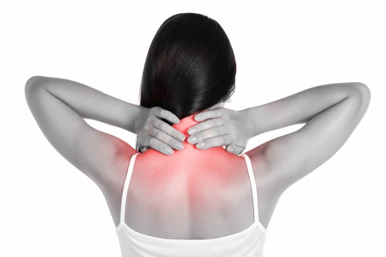 A woman with her hands on her neck, experiencing neck pain. The pain is indicated by red coloring on her neck and shoulders.